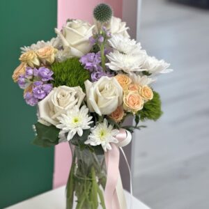 Captivating Floral Elegance: A stunning bouquet of white roses, peach roses, and vibrant purple lisianthus, expertly curated to elevate any celebration.